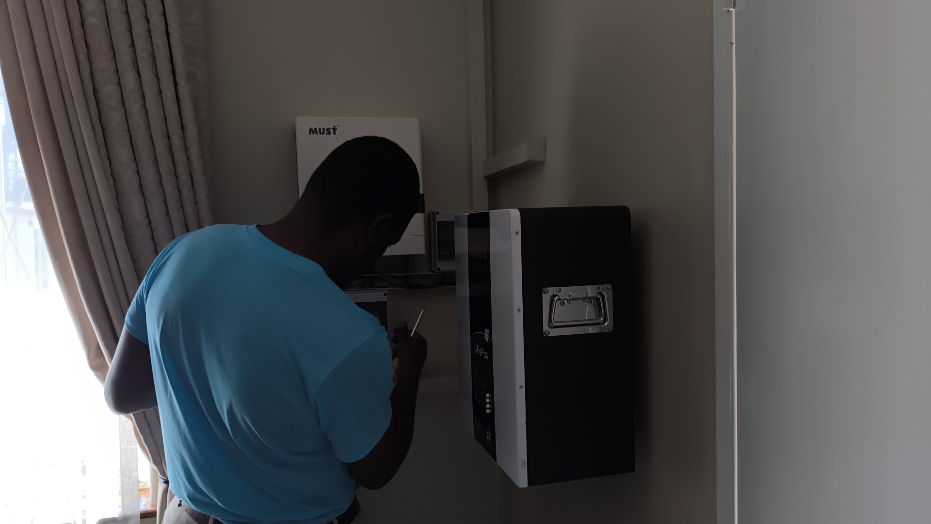 Solarpro technician carrying out inverter cleaning during a Solarpro Care maintenance visit